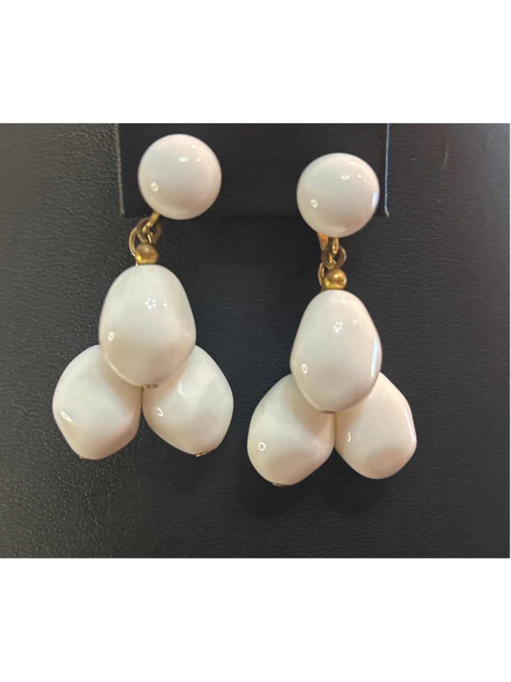 Women's vintage Crown Trifari white lucite dangling cluster clip-on earrings